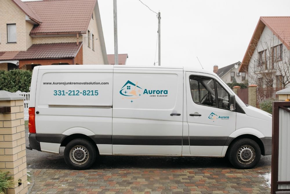A van parked in front of a house, representing a junk removal service in Aurora, CO.