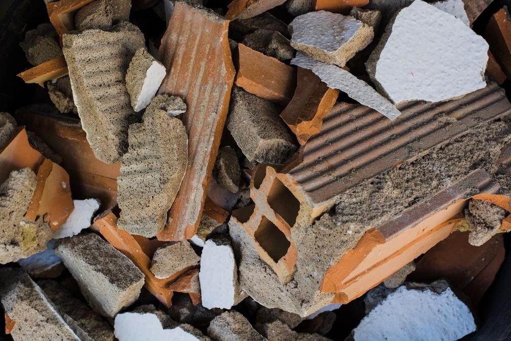 Broken bricks and debris stacked together, representing the remnants of a demolition project in Aurora, CO.